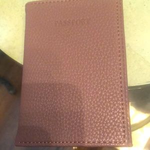 Neiman Marcus brown leather passport holder.